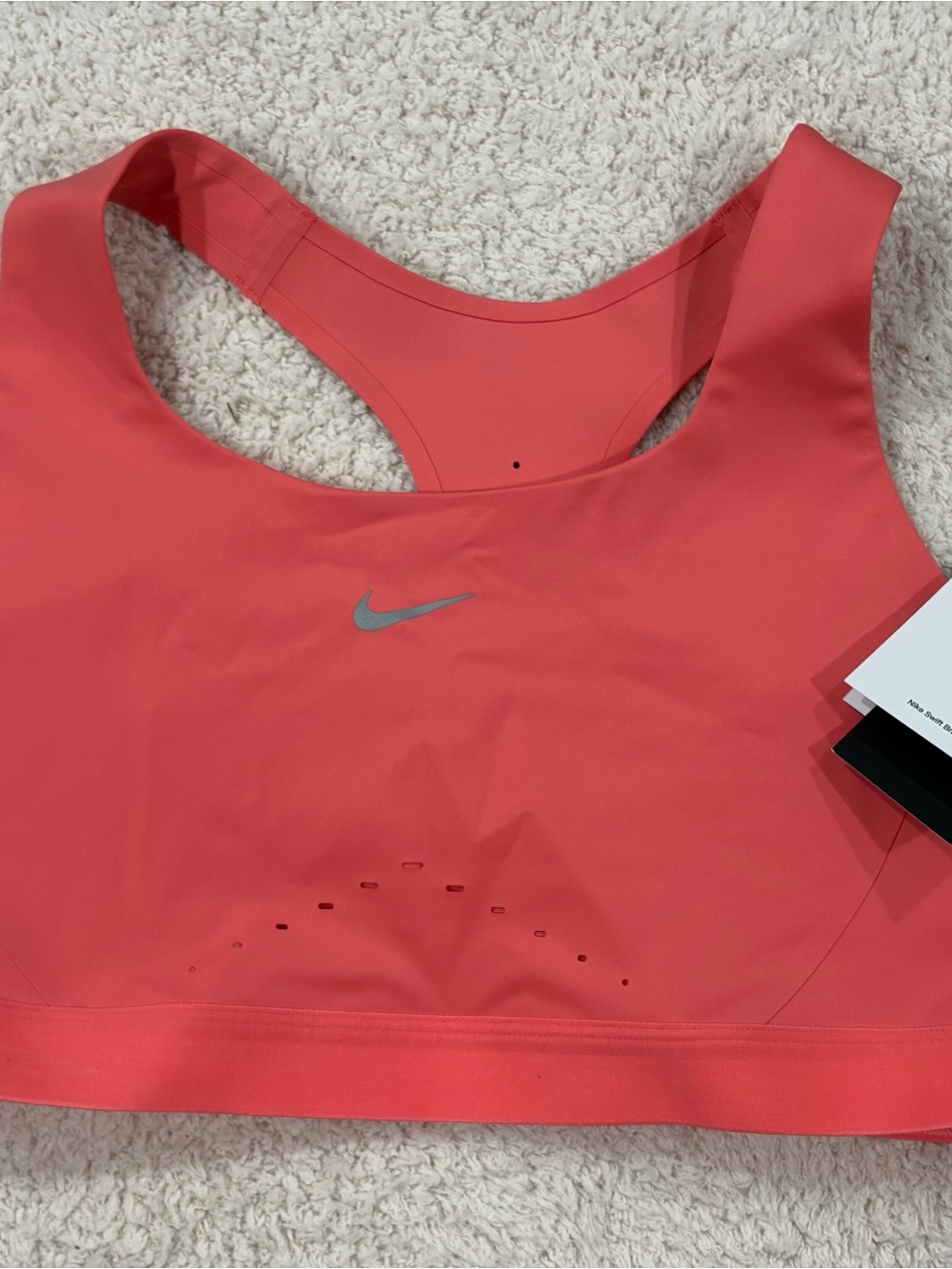 Nike swift sports bra in coral pink, size L. Brand new with tags